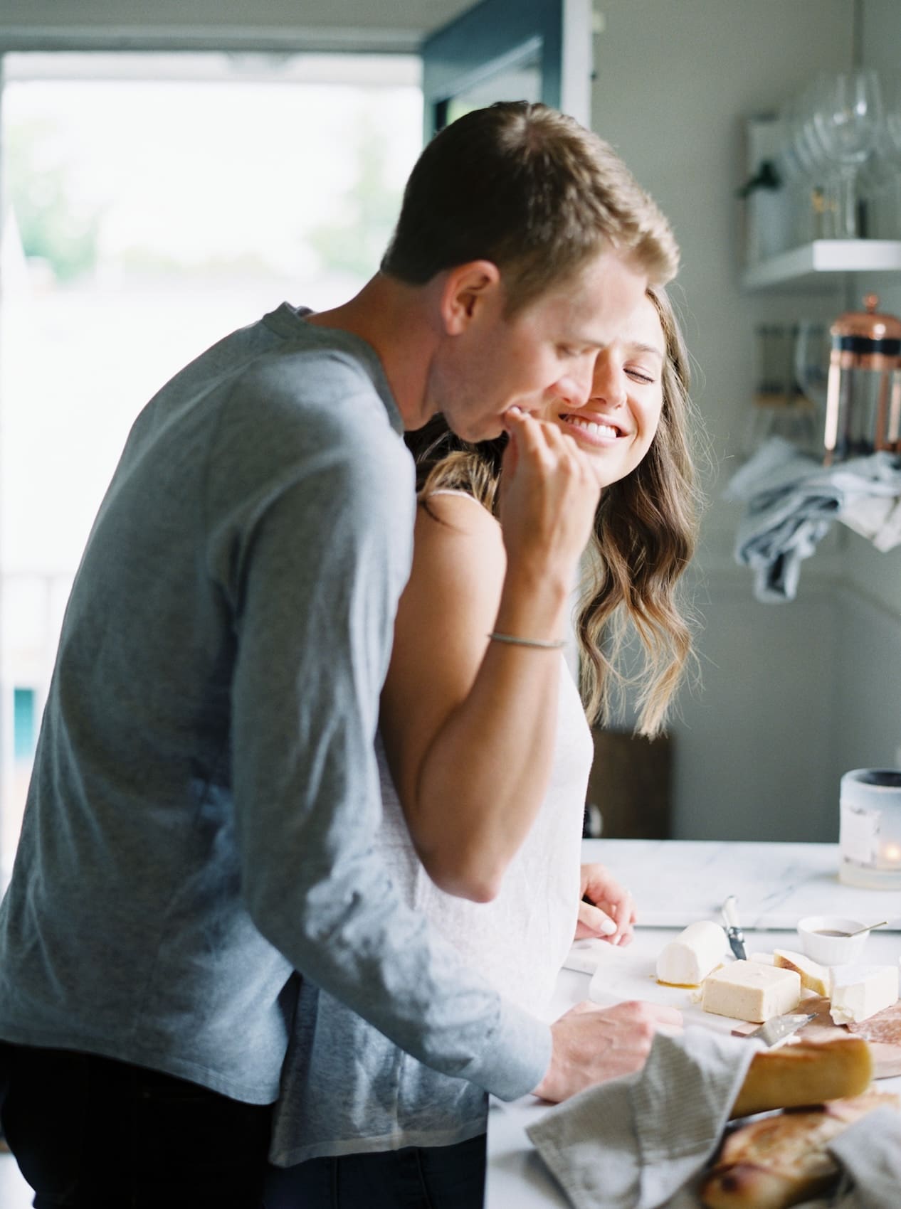 Couple enjoying breakfast together in a cozy kitchen setting