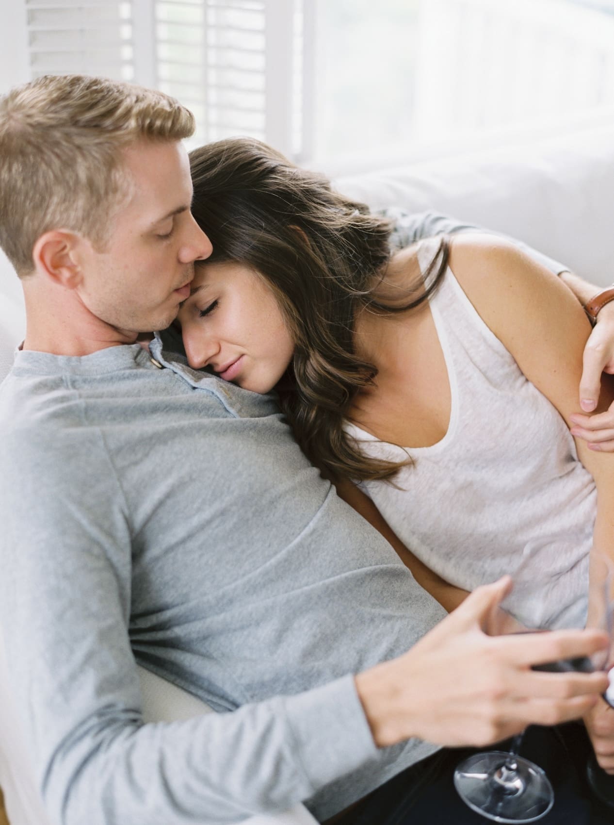 Couple relaxing Seattle at home engagement photoshoot scene