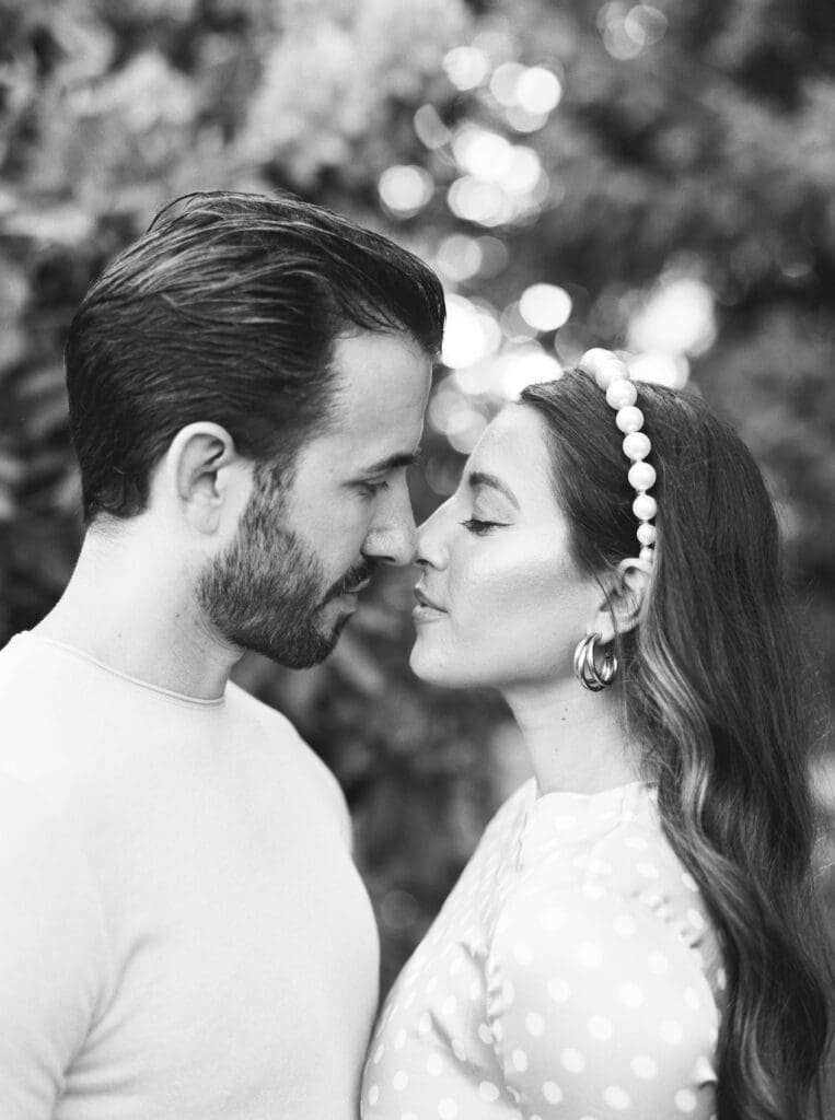 Couple sharing a romantic moment in a garden setting