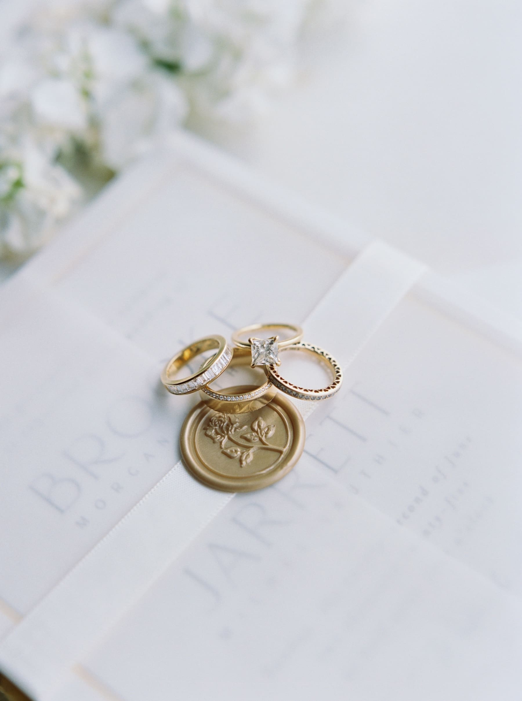 gold and diamond wedding bands and wedding ring macro shot at woodmark hotel wedding