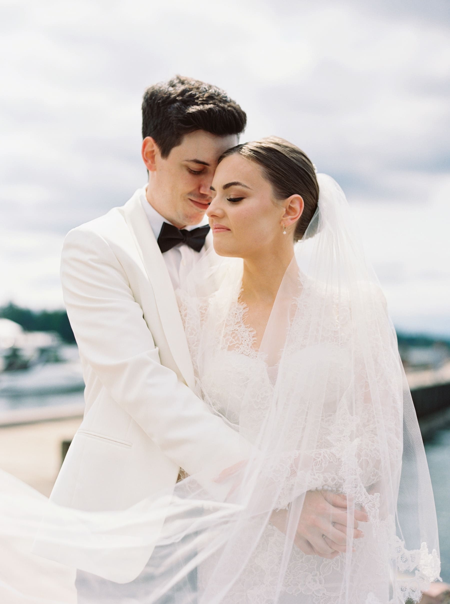 Bride and groom embrace at Woodmark Hotel wedding photography.