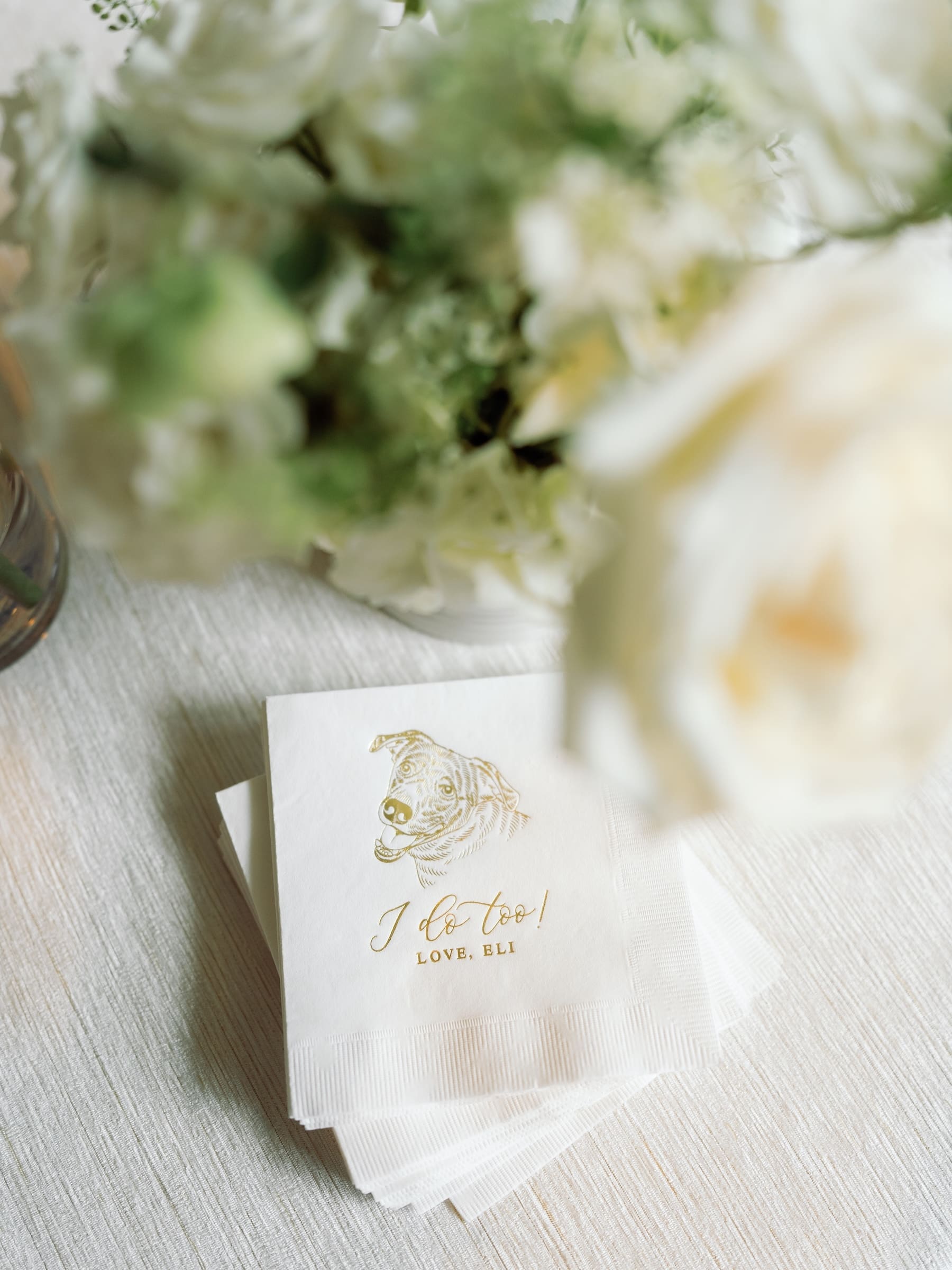 Elegant wedding napkins with floral decor on table