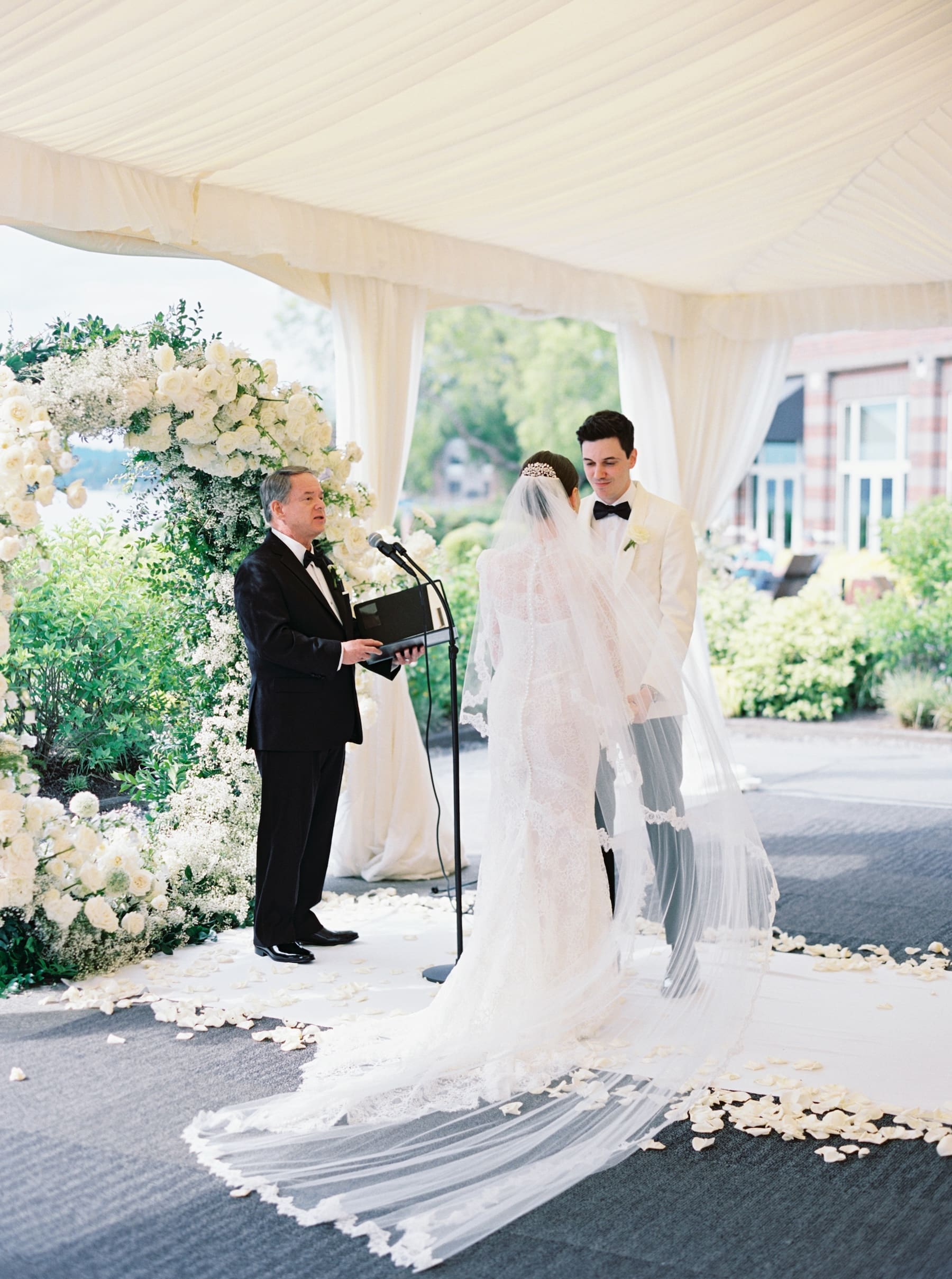Bride and groom exchanging vows at outdoor wedding ceremony