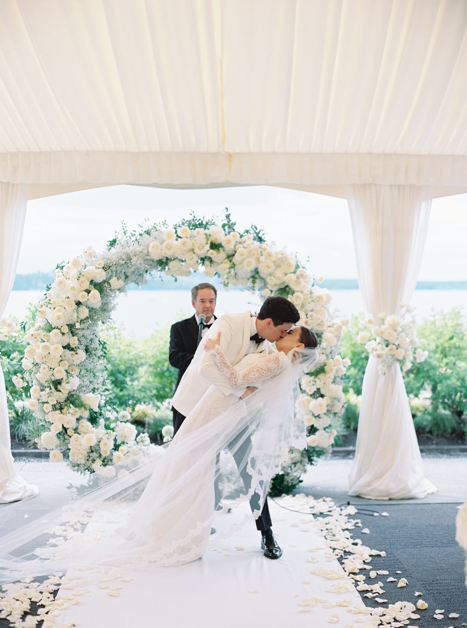 Bride and groom kiss at Woodmark Hotel wedding ceremony