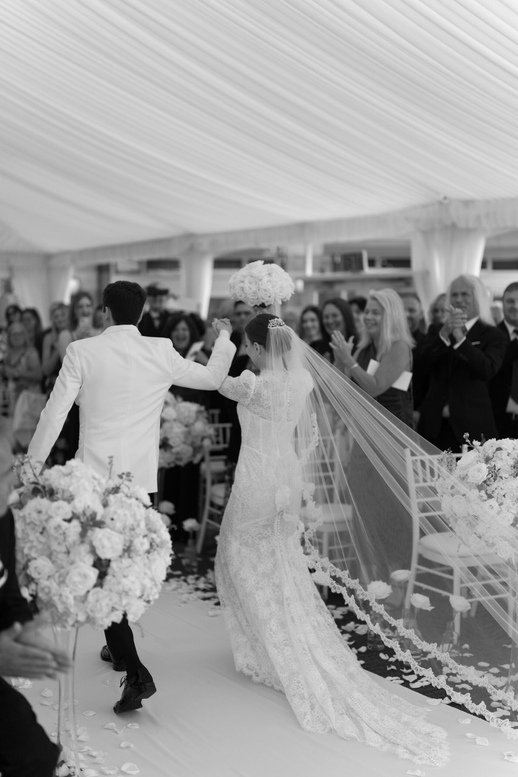 Elegant couple walking down the aisle at their wedding ceremony
