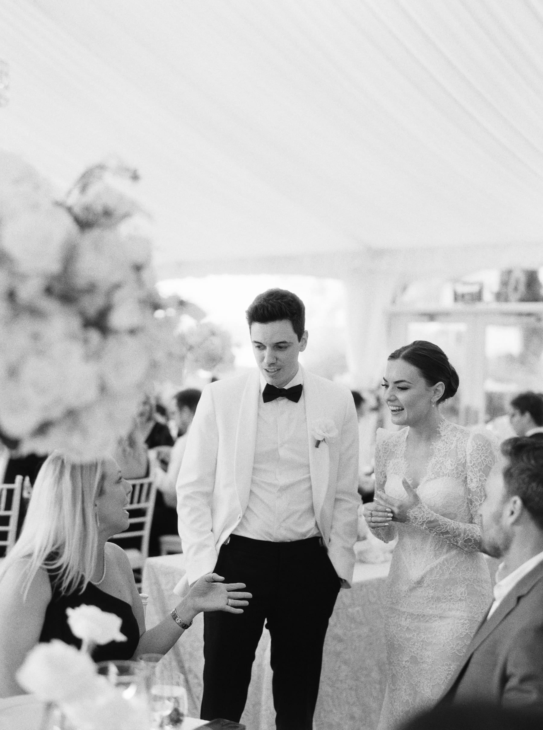 black and white candid photography on film at wedding reception 