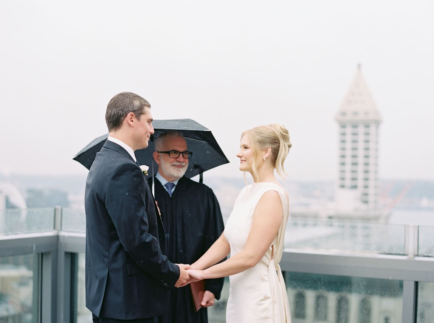 seattle courthouse elopement film photos on the rooftop in the rain